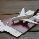 Toy Airplane With Passports and Flight booking ticket. Travel concept.